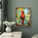 A male cardinal, red bird, in a tree, muted background.