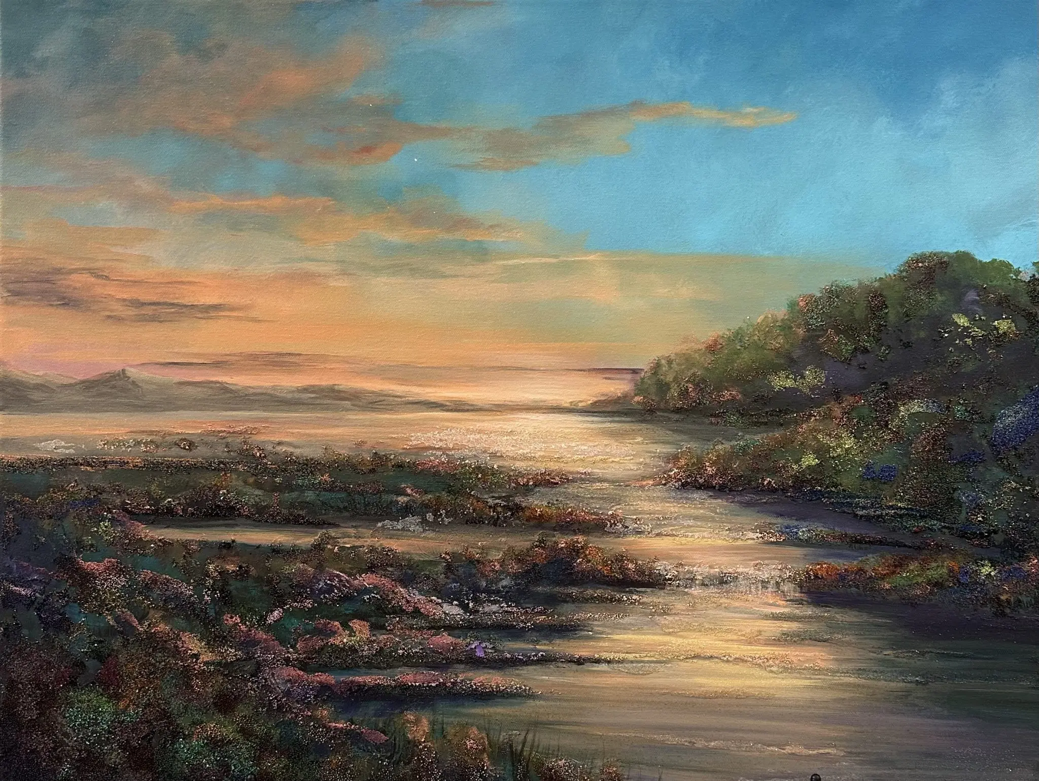 A glowing sunrise over water with golden reflections and shimmering accents of glass, glitter, and mica.