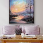 A glowing sunrise over a reflective stream with frosted trees and sparkling glass and mica details along the shoreline