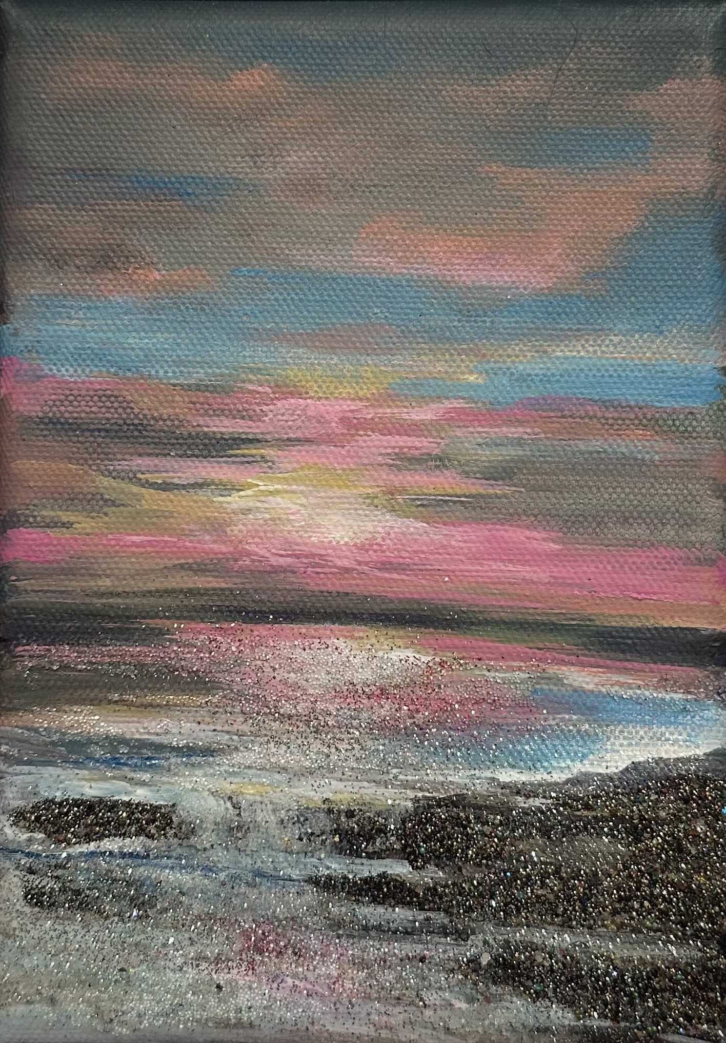 7x5 seascape with glowing pink and gold sunset, shimmering gemstones and mica on the shore, framed in a floater frame.