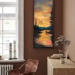 sunset sky with elk in water, geese in sky, reflections in the water