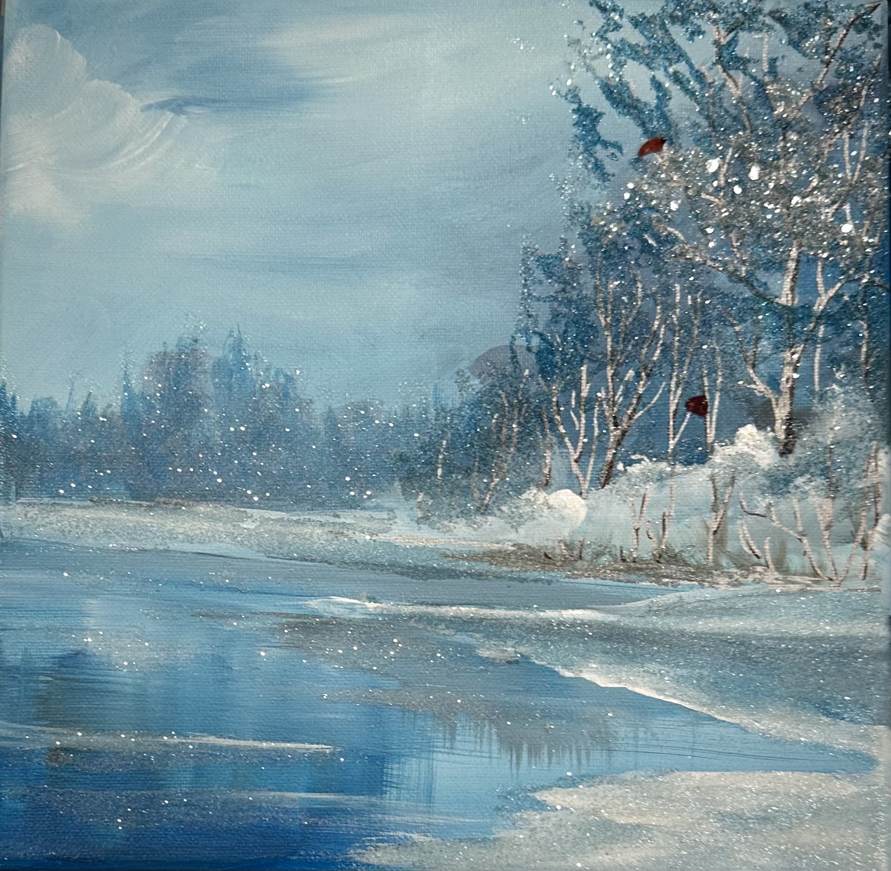 The Still Hour Winter landscape in soft blues with shimmering ice, trees, and subtle sparkle; framed in a chrome floater frame above a holiday mantel.